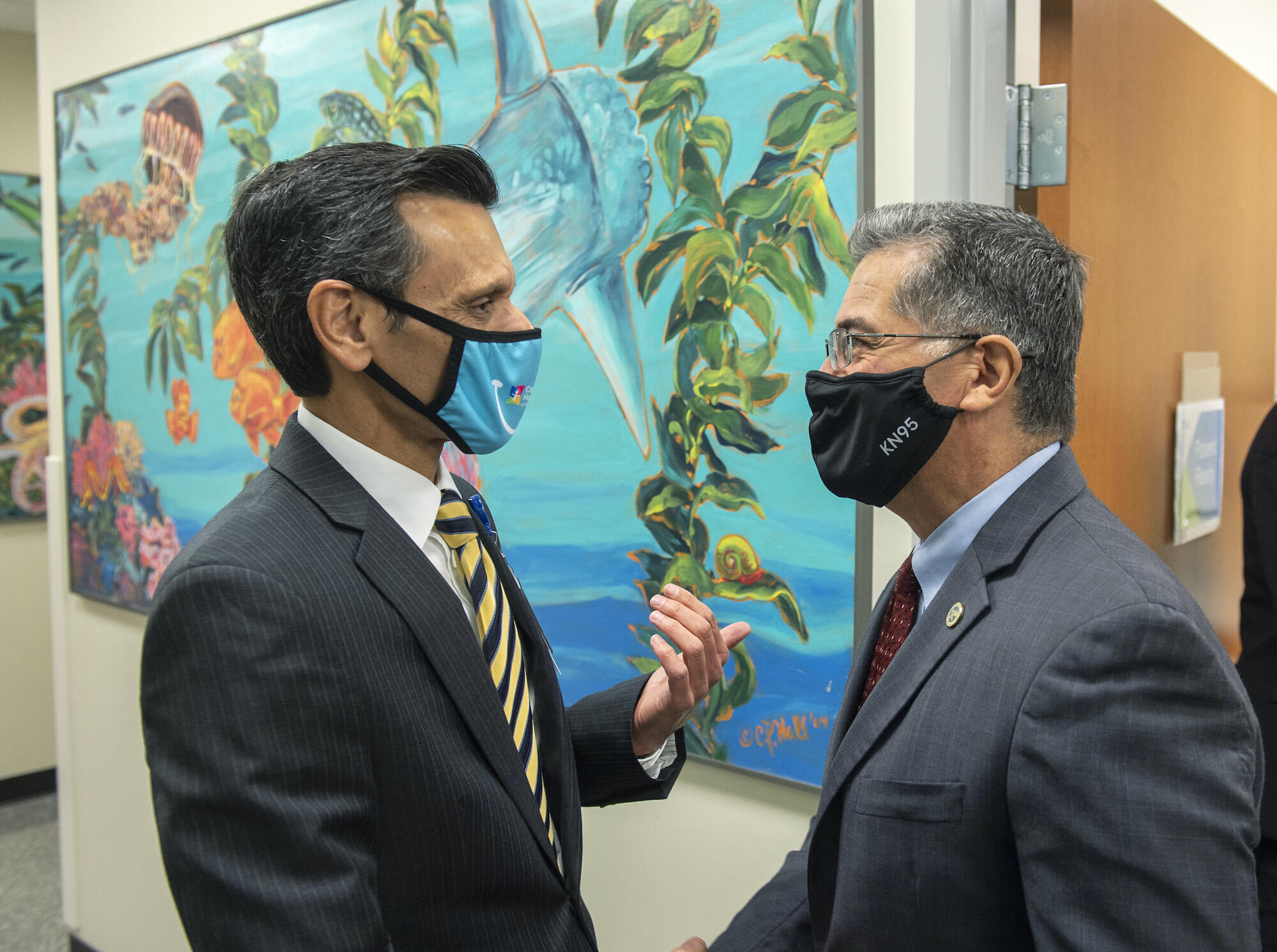 U.S. Secretary of Health and Human Services Xavier Becerra speaks with VCU President Michael Rao during Becerra's visit to Children's Hospital of Richmond at VCU.
