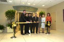 Pictured from left, U.S. Sen. George Allen, Mrs. Laura Bush, Virginia Congressman Eric Cantor, Virginia Congressman Bobby Scott, VCU President Eugene Trani, Virginia First Lady Lisa Collis, Charlotte Roberts and Mrs. Margaret Bush cut the ribbon in front of the Community Health Education Center