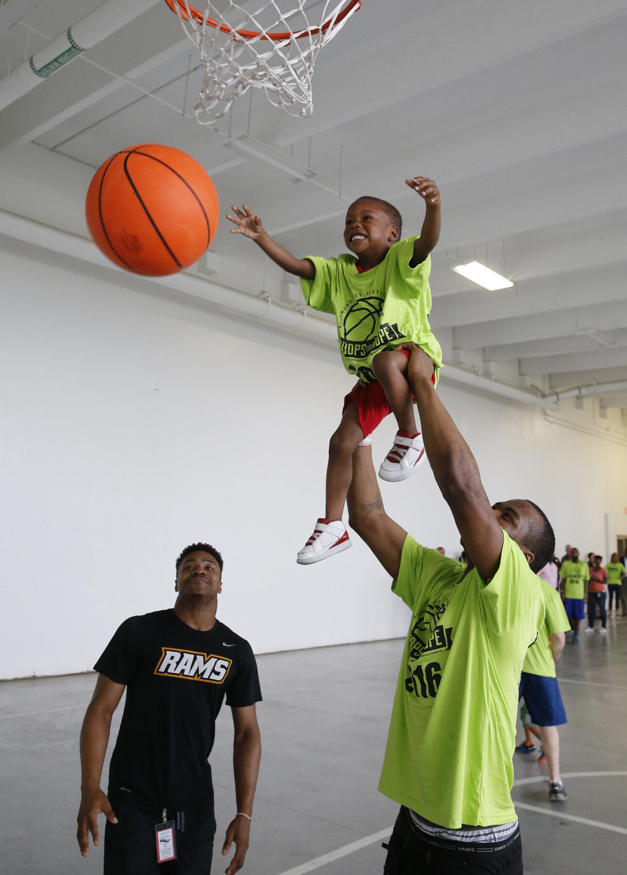 Torey Burston encourages a future basketball star.