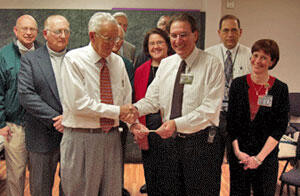 Capital District Kiwanis Foundation Trustee Roy Sheets shakes hands with pediatrics chairman Joseph Laver, M.D., while contributing a check for $4,900.
Looking on from left are Paul Royer, Tuckahoe Kiwanis; Don Sloan, Hanover Kiwanis; H.R. Coates, North Richmond Kiwanis; Tyler Harris, Richmond Kiwanis; Lauren Goodloe, director Pediatric Nursing; Joe Stankus, Lt. Gov., Capital District Kiwanis; John Mickell, M.D., chair, Division of Pediatric Critical Care Medicine; Mary Walker, R.N., nurse manager, Pediatric Intensive Unit.

Photo courtesy of VCUHS Office of Development