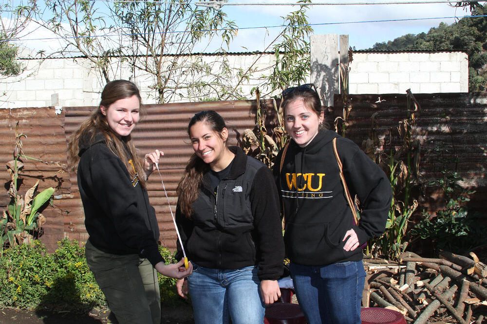 Katherine Connell (B.S. ’15/N) (left), Erica Neary (B.S. ’15/N) and Katie Deasy travel with Nursing Students Without Borders in 2014 to build stoves for families in Guatemala.