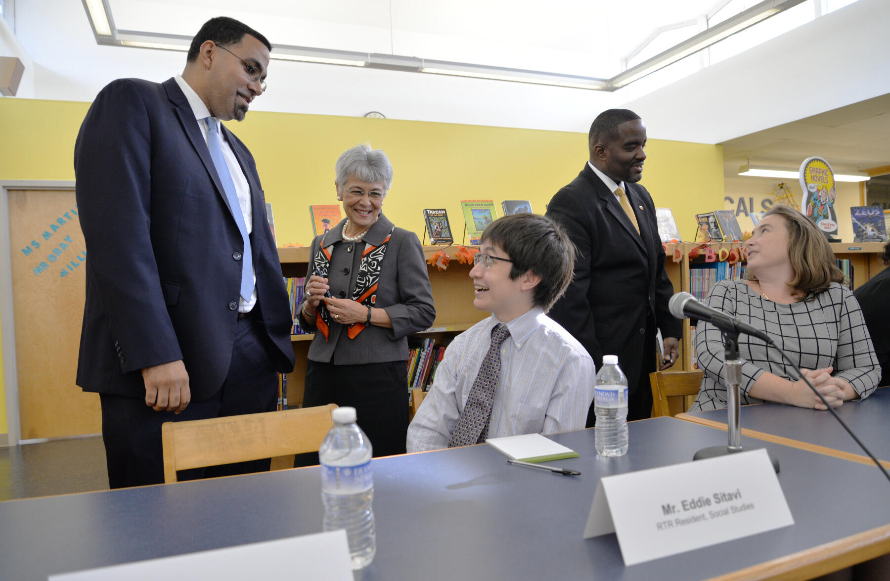 U.S. Secretary of Education John B. King Jr. speaks with Richmond Teacher Residency resident Eddie Sitavi.