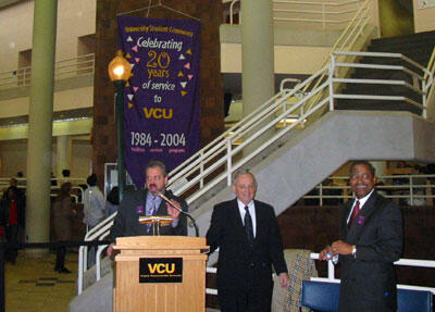 From left: Dr. Timothy Reed, director of University Student Commons & Activities, announces the raising of the Commons 20th anniversary banner. Dr. Eugene P. Trani, VCU president and, Dr. Roderick J. McDavis, provost and vice president for academic affairs, also participated in the ceremony.

Photo by Malorie Janis, University News Services