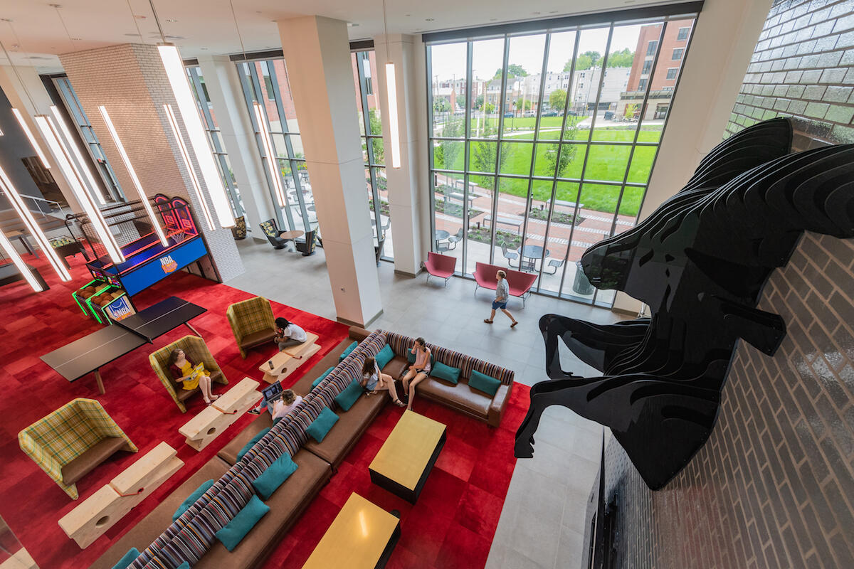 Students hanging out in the lobby of the new Gladding Residence Center. (Photo by Allen Jones, University Relations)