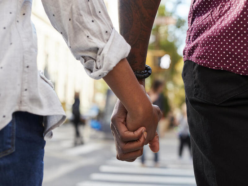Couple holding hands while walking
