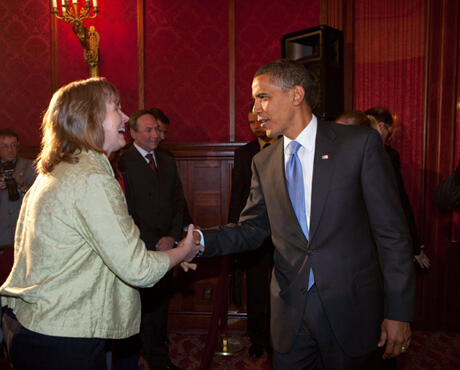 Judyth L. Twigg, Ph.D. associate professor of political science in the L. Douglas Wilder School of Government and Public Affairs, (left) shakes hands with President Barack Obama. The president delivered remarks during the second day of the summit. This photo was taken by a White House photographer and provided by Twigg.
