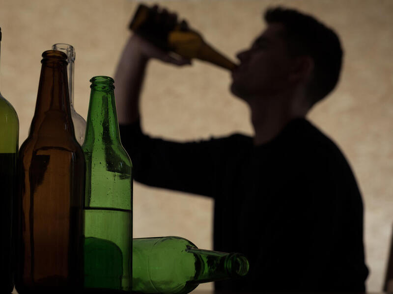 Man drinking beer bottle. 