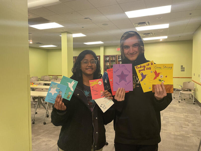 Tvisha Vanteru, a biomedical engineering major, and Damian Ashjian, a computer science major, took part in the "Milk and Cookies" service-learning project designed to help children whose parents are incarcerated. (Contributed photo.)