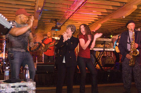 Guests at the grand opening festivities joined the Neville Brothers onstage. 