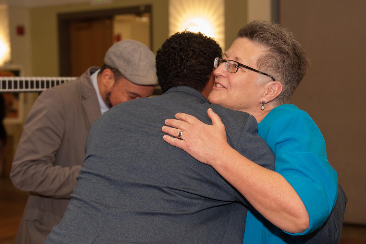 Dorothy Fillmore hugs a friend at the 2016 Presidential Awards for Community Multicultural Enrichment.