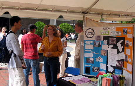 Bruce Park (left), a pre-med student in biology asks questions of Virginia Casanova, School of World Studies, during the VCU Study Abroad Fair, which featured 25 VCU summer study abroad programs and 20 non-VCU programs.  Park is looking to become fluent in Spanish by studying in Latin America or Spain. Photo by Mike Porter, VCU Office of University News Services.