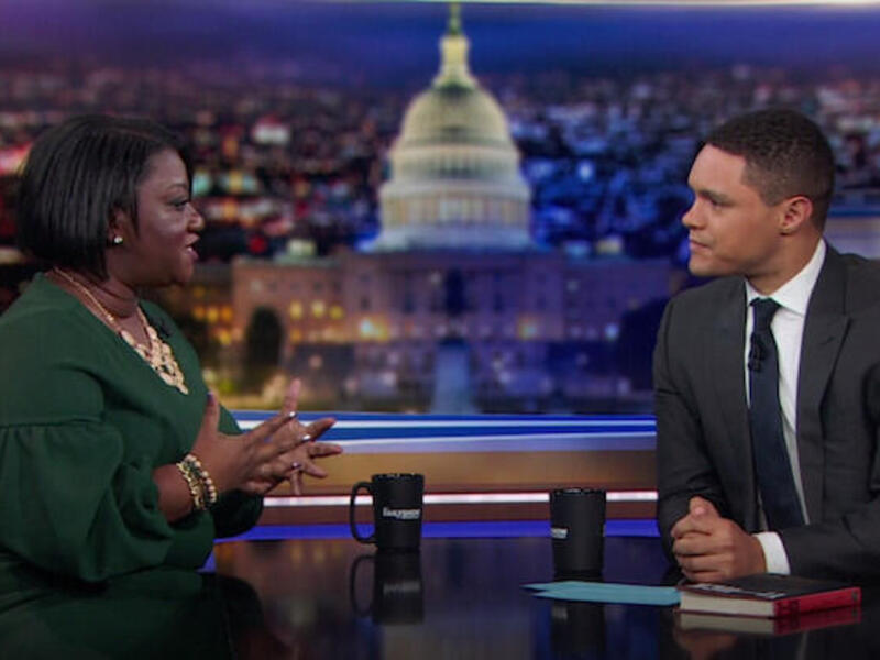 Tressie McMillan Cottom and Trevor Noah on the set of the Daily Show.