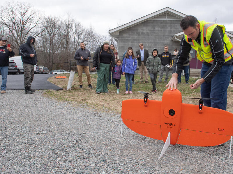 Will Shuart, an assistant professor at the VCU Rice Rivers Center and a geographer with the U.S. Army Corps of Engineers, leads a drone demonstration at the Chickahominy Indian Tribe’s Tribal Center. (Photo by Thomas Kojcsich, Enterprise Marketing and Communications)