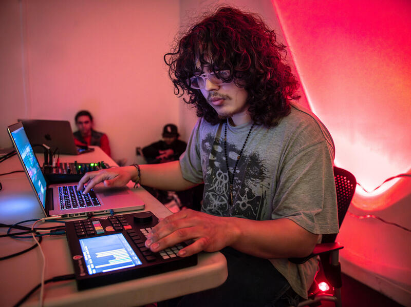 Max Biscarr, a sophomore kinetic imaging major, performs an electronic music composition that incorporates air temperature data and soil temperature data collected at the VCU Rice Rivers Center. (Photo by Allen Jones, Enterprise Marketing and Communications)
