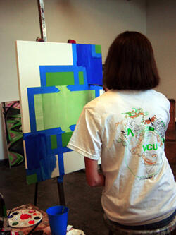 Kristel French of Clover Hill Elementary School in Chesterfield County, works with colors and shapes during the painting workshop. VCU’s Summer Workshop Series attracts hundreds of school teachers from around the country. Photo by Leila Ugincius, VCU Office of University Communications and Public Relations.