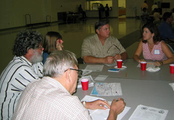 Meghan Gough, right, leads a small group discussion in Harrison County, Miss., as part of that community’s ongoing efforts to recover from Hurricane Katrina. Gough says helping community members to communicate their views is important to the planning and recovery process. Photo courtesy Meghan Gough.