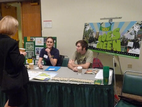 VCU Sustainability Coordinator Jordan Starbuck (center) and Alex French, Green Unity for VCU, discuss VCU’s environmental efforts with a participant at the fourth annual Greening Virginia Universities and Colleges Conference.  Photos by Mike Porter, VCU Communications and Public Relations.