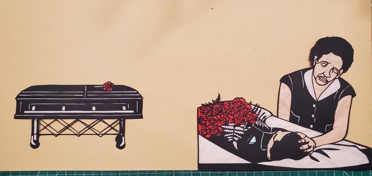 On the left is a paper cut in a coffin and on the right is a woman touching the head of a man lying in a coffin. 
