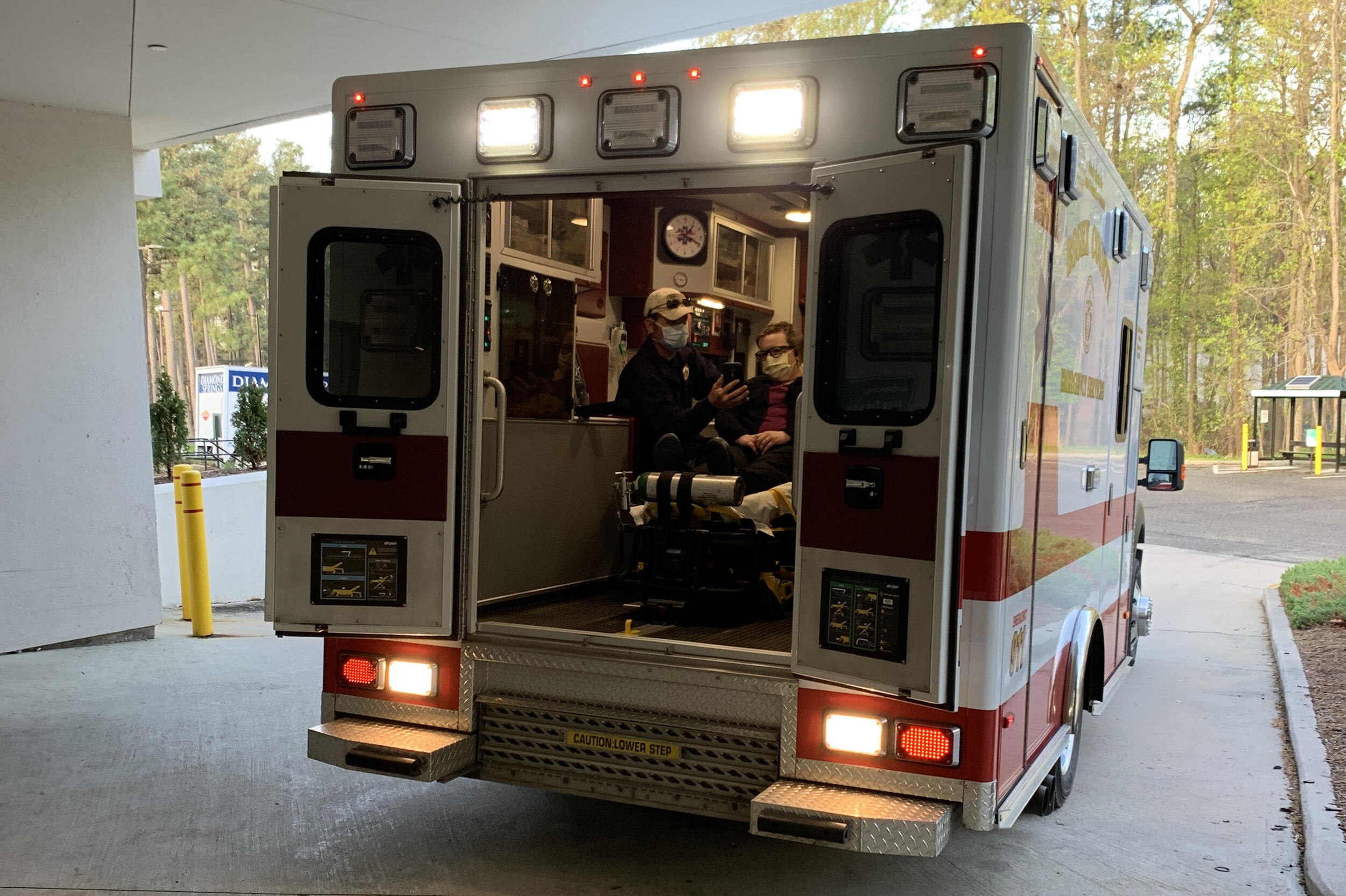An ambulance with two people inside.