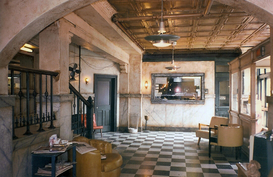 A photo of a the lobby of an apartment building. 