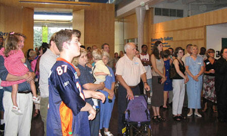 Important Patrons. Some of the 600 attendees look on during a brief ceremony for the VCU Medical Center's PICU, during the 4-hour celebration at the Children's Museum of Richmond.

Photos by Michael Ford, University News Services