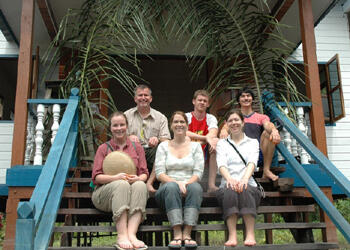 Christmas in Borneo:  Back row from left: Department of Biology Associate Professor  Gregory Plunkett, Ph.D., Christopher Bell and Scott William, front row: Stephanie Davenport, Elizabeth Hiett and Sarah Carr pause on the steps of a Catholic church being built by the Iban people near their longhouse in Sarawak.  Photo provided by Stephanie Davenport.