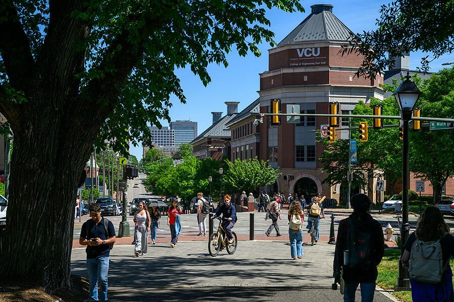 Students walk down a pathway.