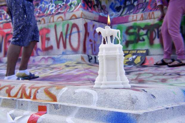 A lit candle placed on a 