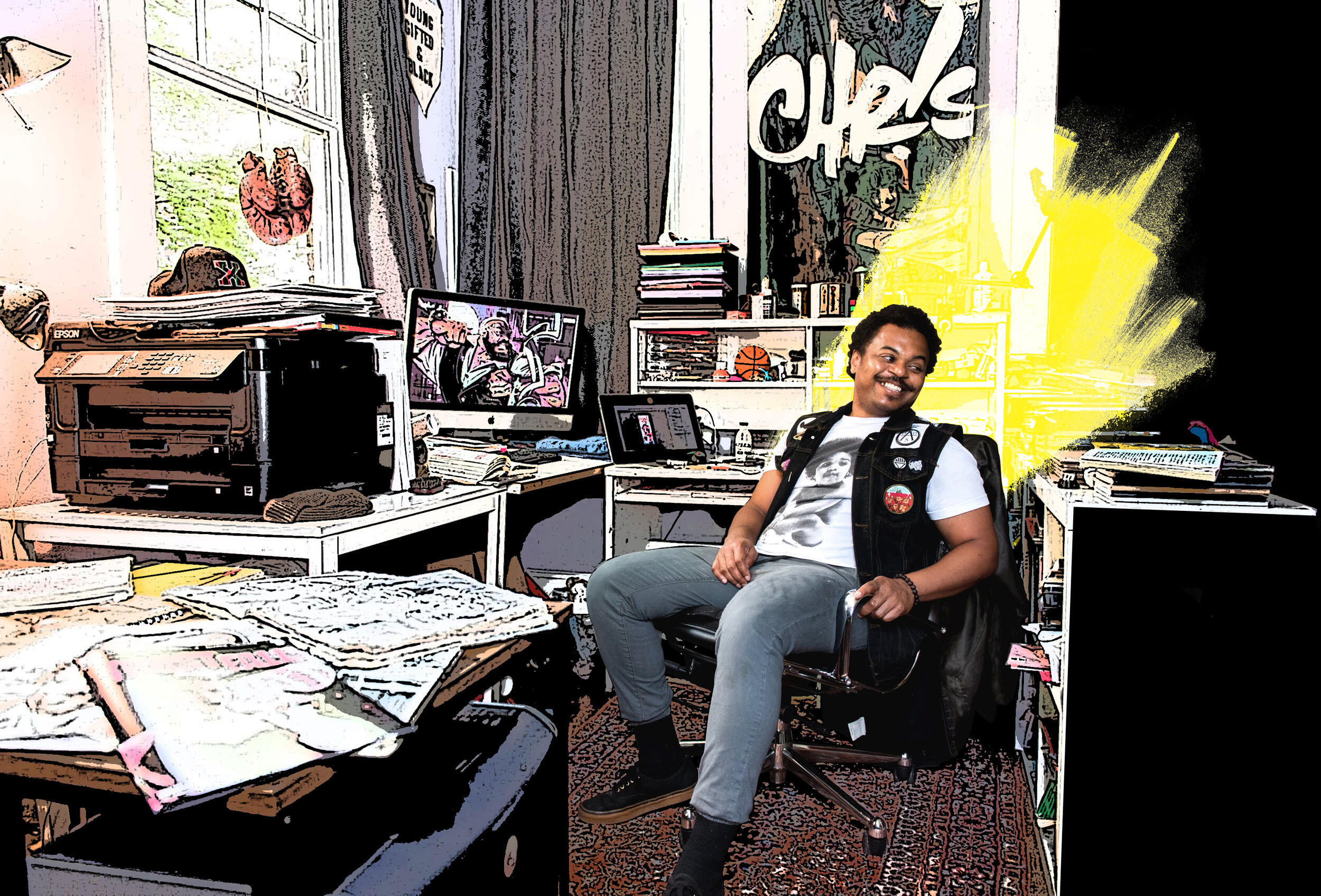 Chris Visions sitting in his art studio.