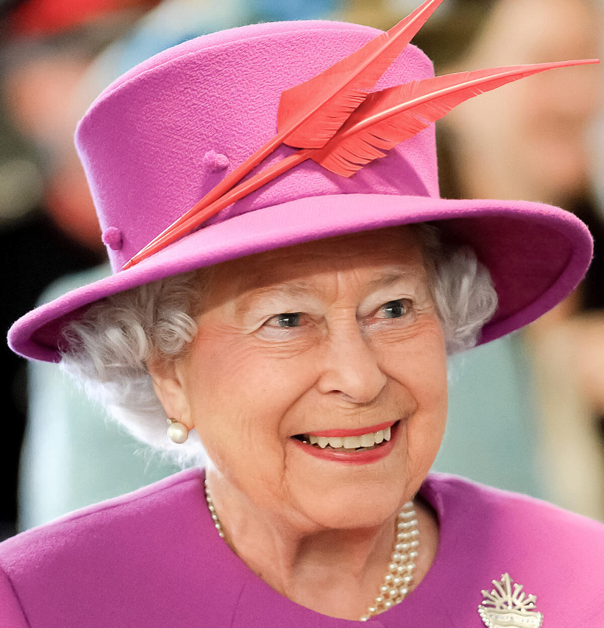 Portrait of Queen Elizabeth II, smiling.