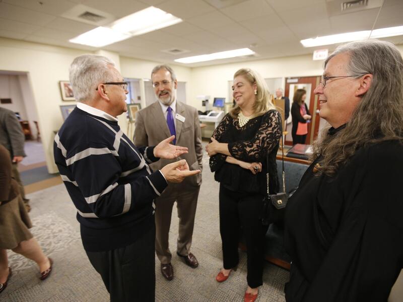 M. Thomas Inge, Ph.D., left, with his wife Donaria, then-VCU Libraries Dean John Ulmschneider, and fantasy artist and comic-book illustrator Charles Vess at a reception for Vess at James Branch Cabell Library in 2013. (Joe Mahoney, VCU Libraries)
