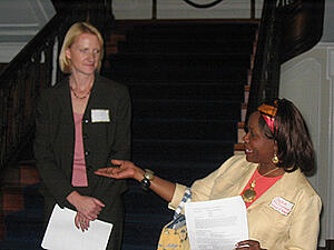 Samantha Marrs, Assistant Vice President, University Advancement and Director of Corporate and Foundation Relations (left), introduces Jackie McDonnough (right) during the community engagement awards presentation at Scott House. McDonnough is coordinating a partnership between the departments of teaching and learning, physics, VCU Life Sciences and St. Andrew’s School in Oregon Hill to increase student interest in science. The effort is one of nine VCU-community partnerships to receive grants to respond to community-identified problems. Photo by Mike Porter, University News Services.