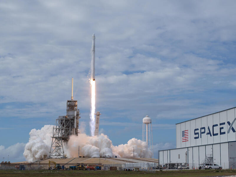 A SpaceX Falcon 9 rocket lifts off fro NASA's Kennedy Space Center.