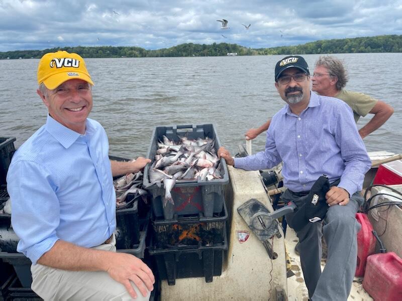 U.S. Rep. Rob Wittman and P. Srirama Rao, Ph.D., vice president for research and innovation, saw a demonstration of an experimental way to harvest invasive blue catfish at the VCU Rice Rivers Center on Wednesday. (Photo by Joe Schumacher, district director for Rep. Wittman.)