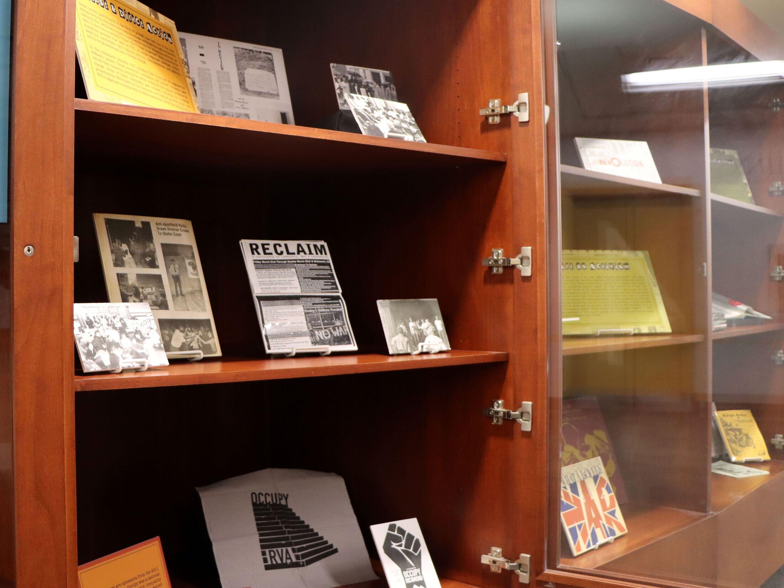An open bookcase with items on display.