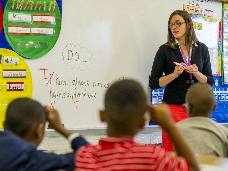 Grace Giampietro teaching in a classroom of students.