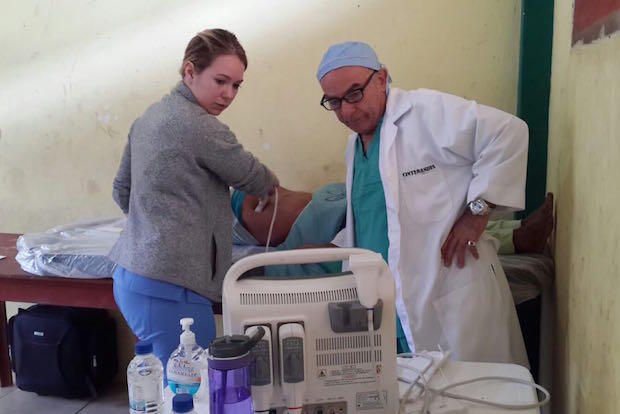 Aspiring doctor Cassie Valukas works an ultrasound machine on a medical mission trip to Ecuador.