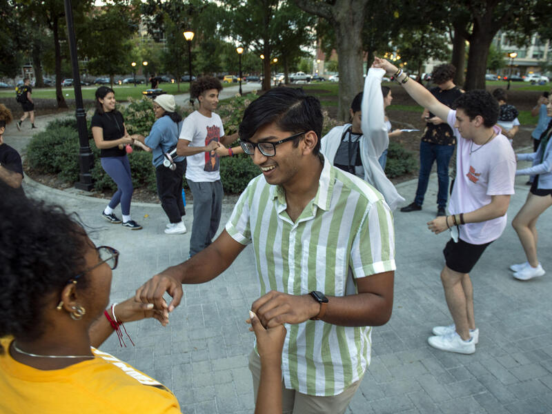 Students dancing in Monroe Park 