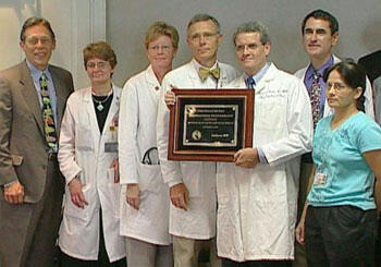 Colleagues and friends from the Division of Pulmonary and Critical Care at VCU accepted a plaque on behalf of Muren.