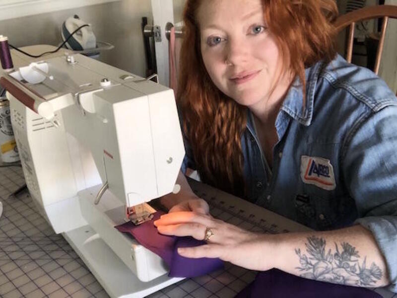 VCU School of the Arts fashion instructor Shannon Kessler assembles masks from the kit.