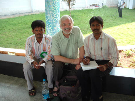 Virginia Center on Aging Director Edward F. Ansello, (center), was the keynote speaker at the Gerontology International Synthesis Conference 2009 at Andhra University in India.  Here, he meets informally with two university students. Photo provided by Edward Ansello.