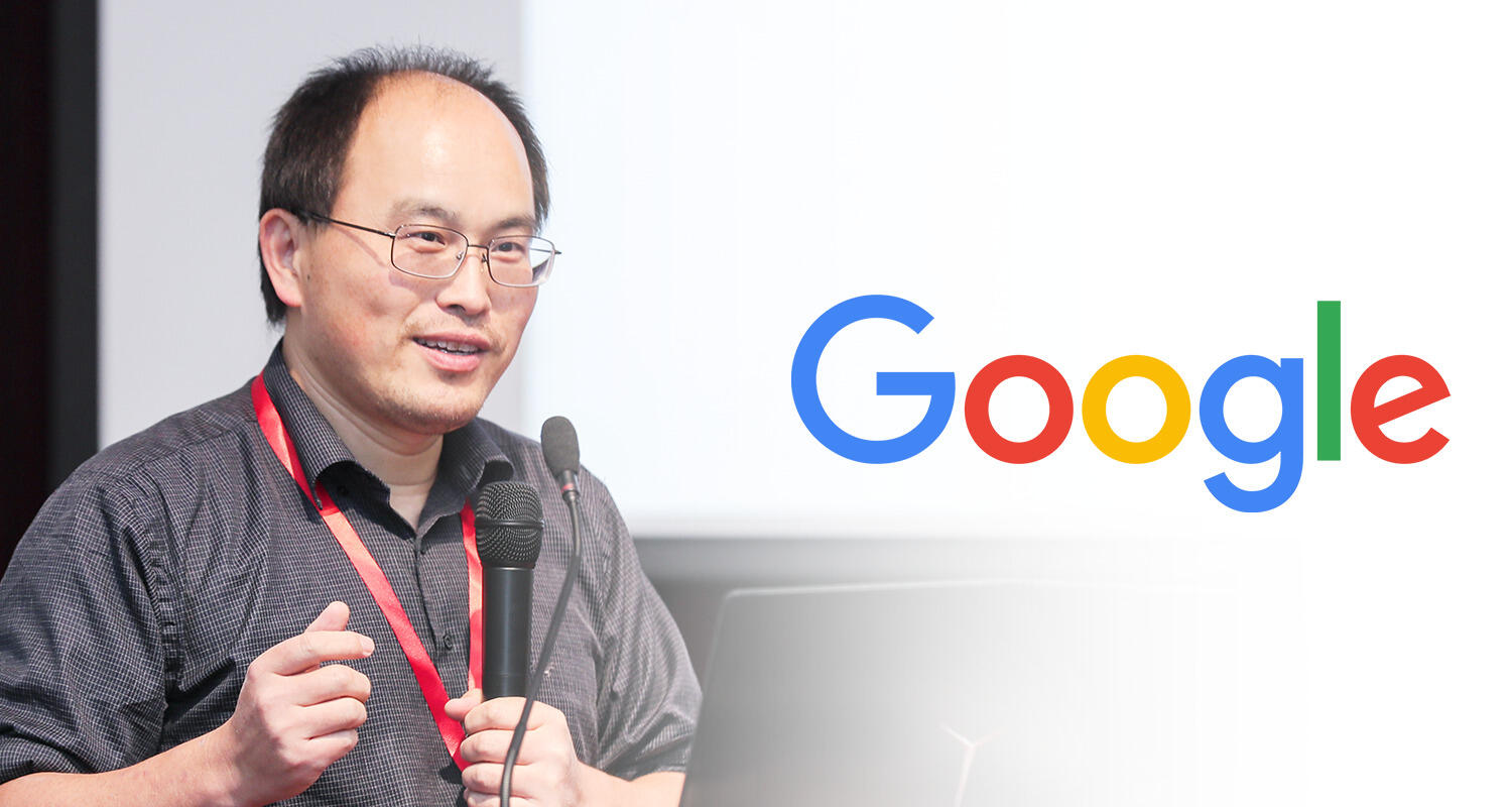 Man standing at lectern with "Google" logo at right.