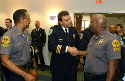From left Capt. Carlton Edwards of the VCU Police, Richmond Police Maj. David M. McCoy and VCU Police Chief Willie B. Fuller greet one another before the start of the breakfast.