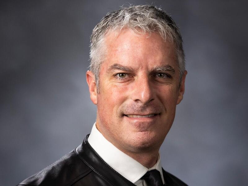 A photo of a man from the shoulders up