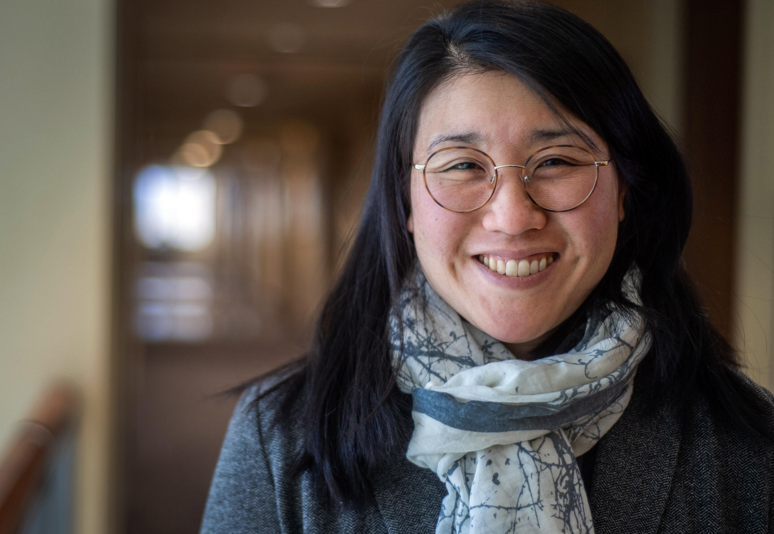 A photo of a woman from the shoulders up. 