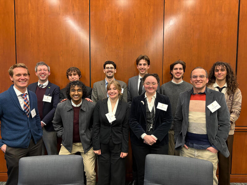 A group photo of 11 people. 