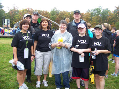 VCU faculty, staff and family members show their support at the heart walk. Front row (l-r): Amy Unger, director of human resources administration, Office of the Provost and Academic Affairs; Debbie Fitzgerald, work/life resources and recognition coordinator, VCU Human Resources; Pam Currey, associate vice president, VCU Finance and Administration; Morgan Stickels; and Cheri Stickels, special assistant to the vice president, VCU Finance and Administration. Back row (l-r): Joan Putney, Don Currey and John Bennett, senior vice president, VCU Finance and Administration. Photo by Laura Savage