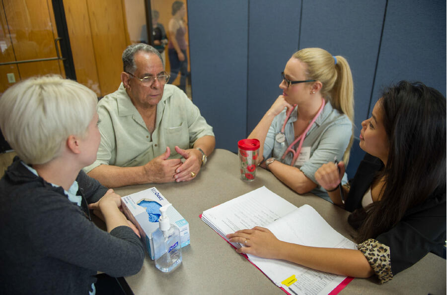 Students from VCU’s health sciences schools consult with a Dominion Place resident as part of the Richmond Health and Wellness Program.
<br>Photo by Allen Jones, VCU University Marketing.