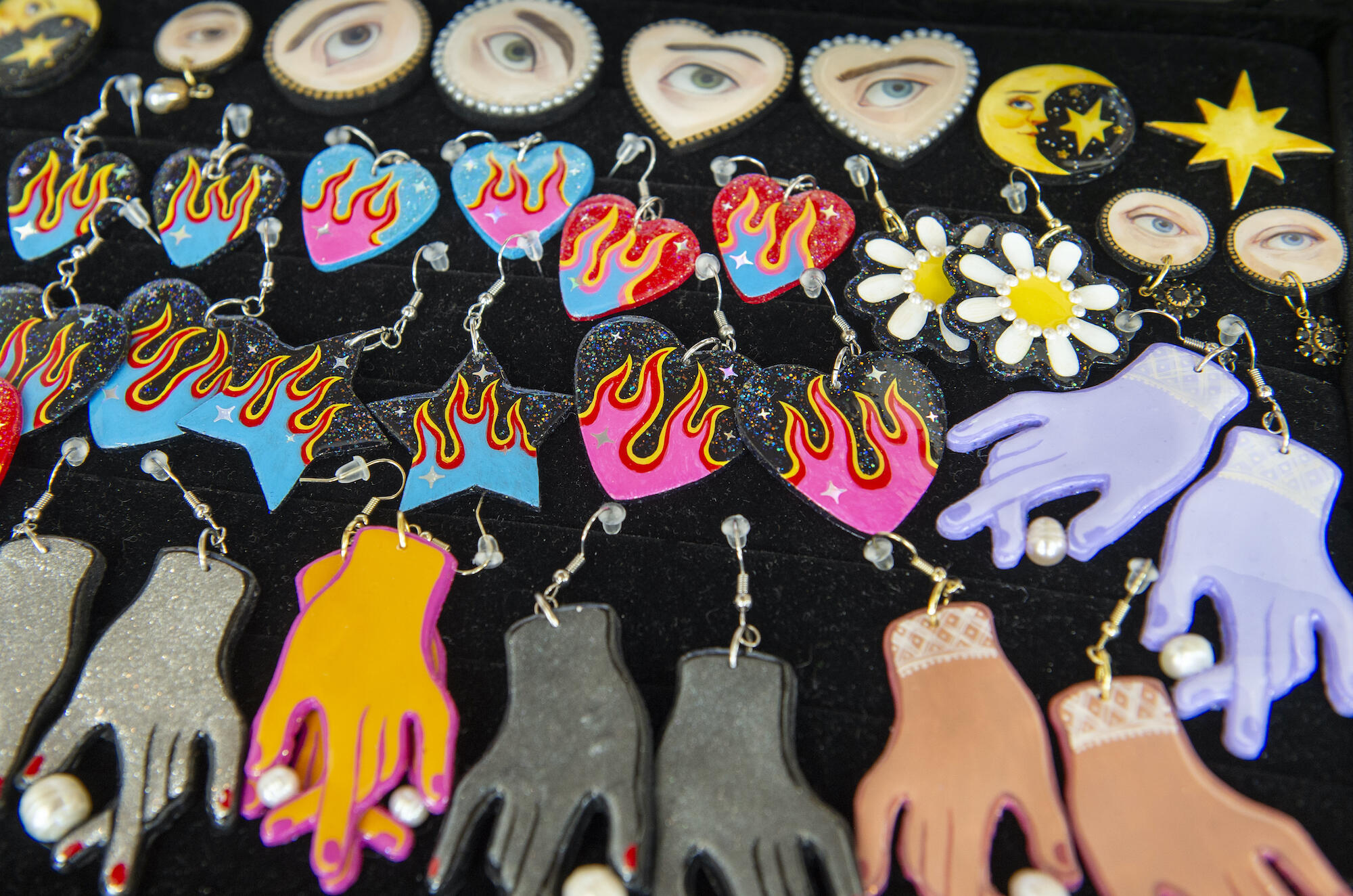 Earrings made by Abby Giuseppe. These are hand cut clay earrings/clay which are baked and painted.