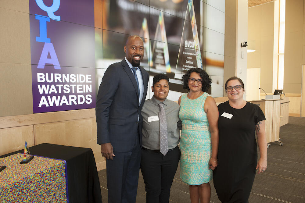 Aashir Nasim, Ph.D., with award recipients Alexa Santisteban and Archana Pathak, Ph.D., and Liz Canfield, an assistant professor in the Department of Gender, Sexuality and Women’s Studies. (Photo by Tom Kojcsich, University Relations)
